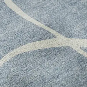 Photo of Denim Blue And Ivory Abstract Washable Area Rug With UV Protection
