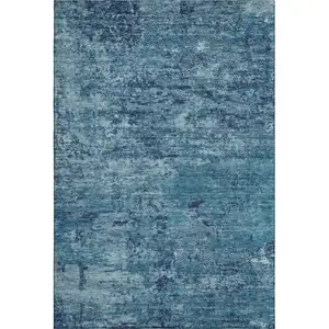 Photo of Denim Blue And Ivory Abstract Washable Area Rug With UV Protection
