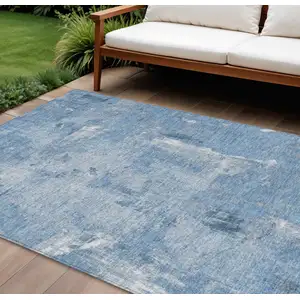 Photo of Denim Blue And Ivory Abstract Washable Indoor Outdoor Area Rug