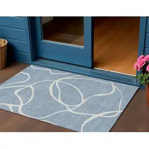 Photo of Denim Blue And Ivory Abstract Washable Indoor Outdoor Area Rug