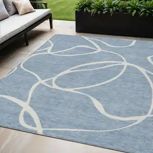 Photo of Denim Blue And Ivory Abstract Washable Indoor Outdoor Area Rug