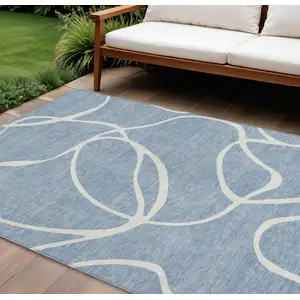 Photo of Denim Blue And Ivory Abstract Washable Indoor Outdoor Area Rug