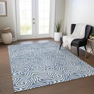Photo of Denim Blue And Ivory Abstract Washable Indoor Outdoor Area Rug
