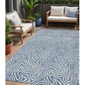 Photo of Denim Blue And Ivory Abstract Washable Indoor Outdoor Area Rug