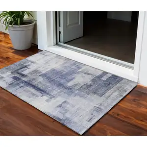 Photo of Denim Blue And Ivory Abstract Washable Indoor Outdoor Area Rug