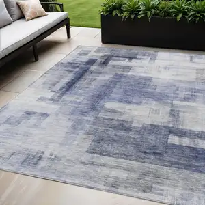 Photo of Denim Blue And Ivory Abstract Washable Indoor Outdoor Area Rug