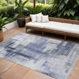 Photo of Denim Blue And Ivory Abstract Washable Indoor Outdoor Area Rug