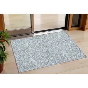 Photo of Denim Blue And Ivory Damask Washable Indoor Outdoor Area Rug
