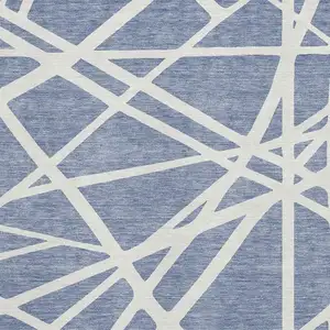 Photo of Denim Blue And Ivory Geometric Washable Area Rug With UV Protection