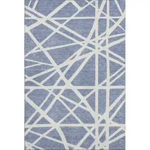 Photo of Denim Blue And Ivory Geometric Washable Area Rug With UV Protection