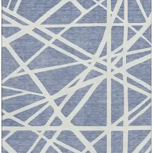 Photo of Denim Blue And Ivory Geometric Washable Area Rug With UV Protection