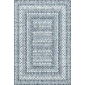 Photo of Denim Blue And Ivory Geometric Washable Area Rug With UV Protection