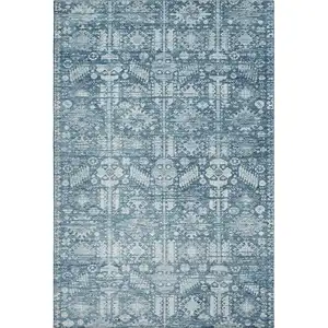 Photo of Denim Blue And Ivory Oriental Washable Area Rug With UV Protection