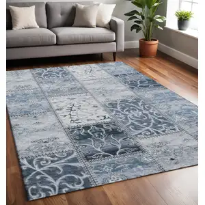 Photo of Denim Blue And Ivory Patchwork Washable Area Rug With UV Protection