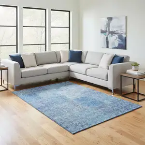 Photo of Denim Blue And Ivory Patchwork Washable Area Rug With UV Protection