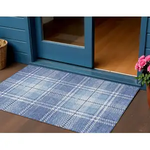 Photo of Denim Blue And Ivory Plaid Washable Indoor Outdoor Area Rug