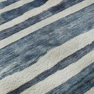 Photo of Denim Blue And Ivory Striped Washable Area Rug With UV Protection