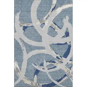 Photo of Denim Blue Gray And Ivory Abstract Washable Area Rug With UV Protection