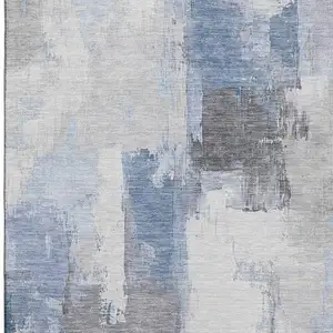 Photo of Denim Blue Gray And Ivory Abstract Washable Area Rug With UV Protection