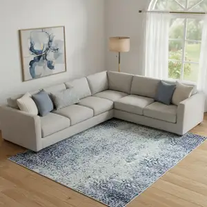 Photo of Denim Blue Gray And Ivory Abstract Washable Area Rug With UV Protection