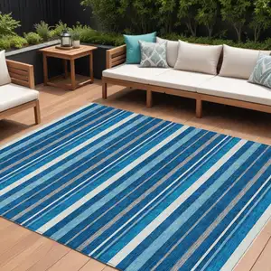 Photo of Denim Blue Gray And Ivory Striped Washable Indoor Outdoor Area Rug