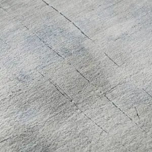 Photo of Denim Blue Gray And Silver Abstract Washable Area Rug With UV Protection