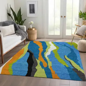 Photo of Denim Blue Orange And Lime Green Abstract Washable Area Rug With UV Protection