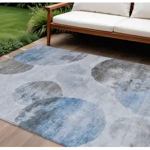 Photo of Denim Blue Taupe And Ivory Abstract Washable Indoor Outdoor Area Rug