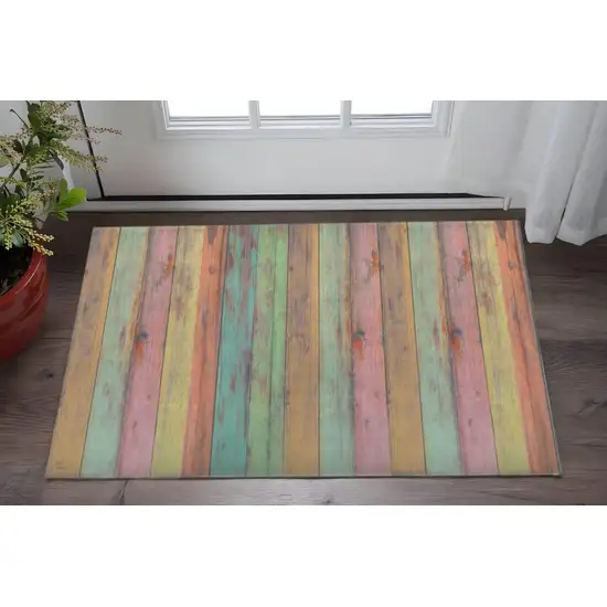 Distressed Aqua Green And Pink Printed Vinyl Area Rug With UV Protection Photo 1