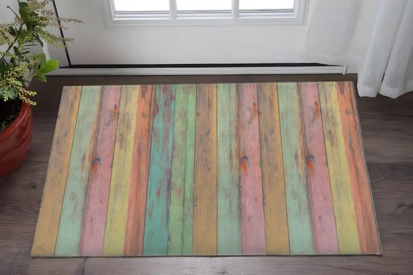 Distressed Aqua Green And Pink Printed Vinyl Area Rug With UV Protection Photo 1