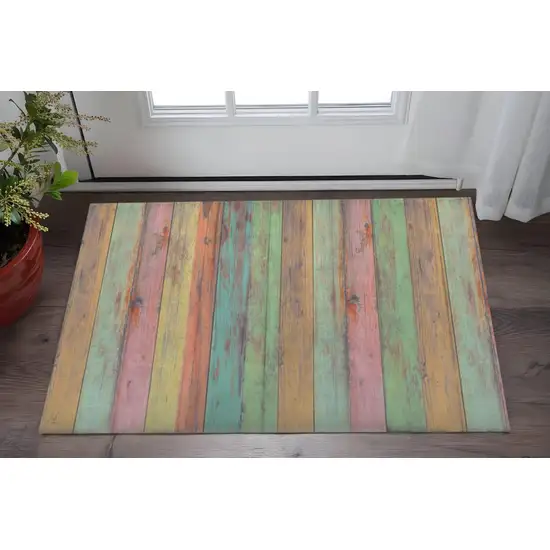 Distressed Aqua Green And Pink Printed Vinyl Area Rug With UV Protection Photo 1