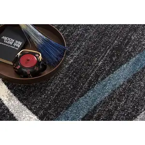 Photo of Distressed Black and Gray Abstract Area Rug