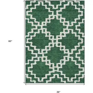 Photo of Emerald And Ivory Geometric Washable Indoor Outdoor Area Rug