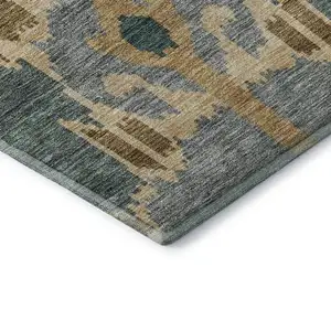 Photo of Emerald Gold And Gray Ikat Washable Area Rug With UV Protection