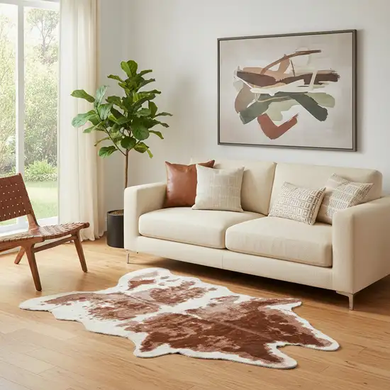 Brown And Ivory Faux Cowhide Animal Print Area Rug Photo 1