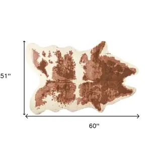 Photo of Faux Cow Hide Brown And Ivory Area Rug
