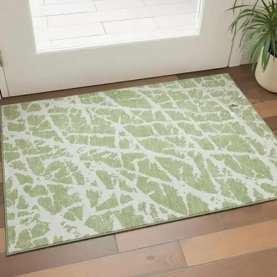 Fern Green And Ivory Abstract Washable Area Rug With UV Protection Photo 1