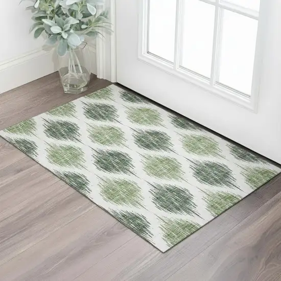 Fern Green And Ivory Ikat Washable Area Rug With UV Protection Photo 1