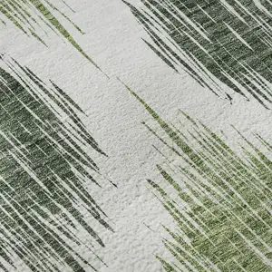 Photo of Fern Green And Ivory Ikat Washable Area Rug With UV Protection