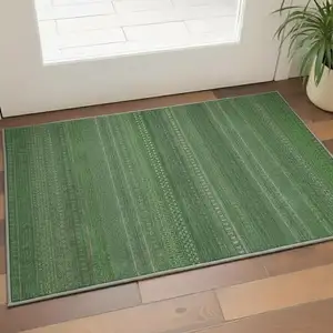 Photo of Fern Green And Ivory Striped Washable Area Rug With UV Protection