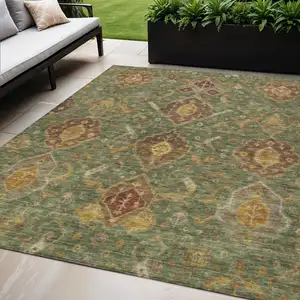 Photo of Fern Green Brown And Gold Ikat Washable Indoor Outdoor Area Rug