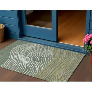 Photo of Fern Green Ivory And Gold Striped Washable Indoor Outdoor Area Rug
