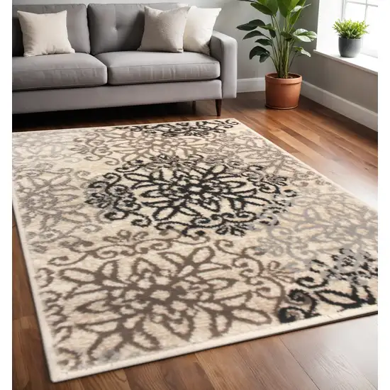 Beige Black And Brown Floral Medallion Area Rug Photo 1