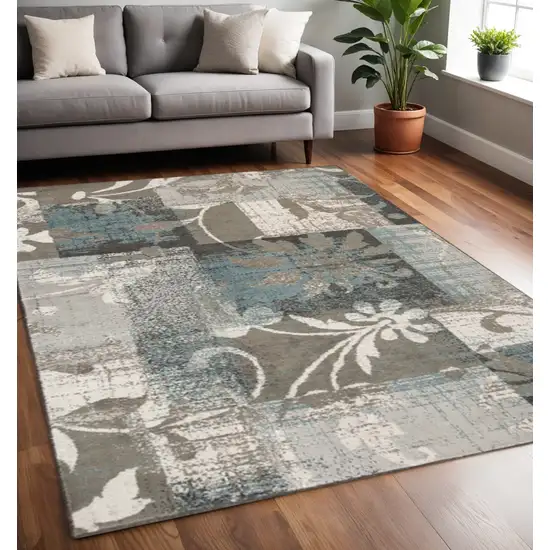 Tan And Gray Floral Distressed Area Rug Photo 1