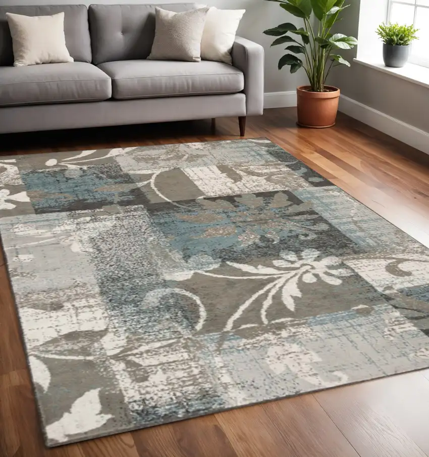 Tan And Gray Floral Distressed Area Rug Photo 1