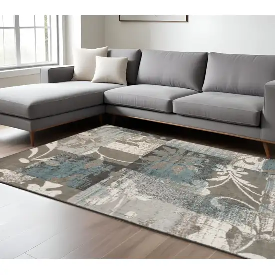 Tan And Gray Floral Distressed Area Rug Photo 1
