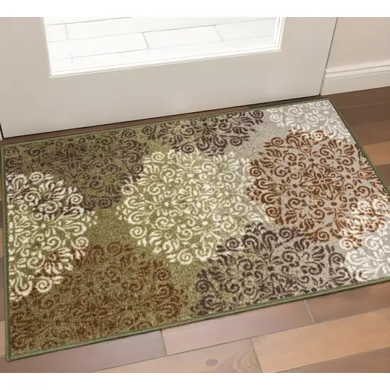 Brown Green And Ivory Floral Medallion Area Rug Photo 1