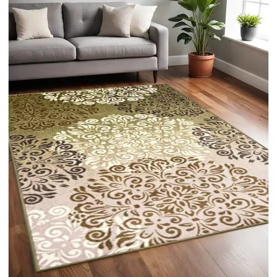 Brown Green And Ivory Floral Medallion Area Rug Photo 1