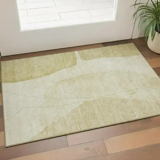 Gold And Beige Abstract Washable Area Rug With UV Protection Photo 1
