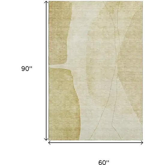 Gold And Beige Abstract Washable Area Rug With UV Protection Photo 3